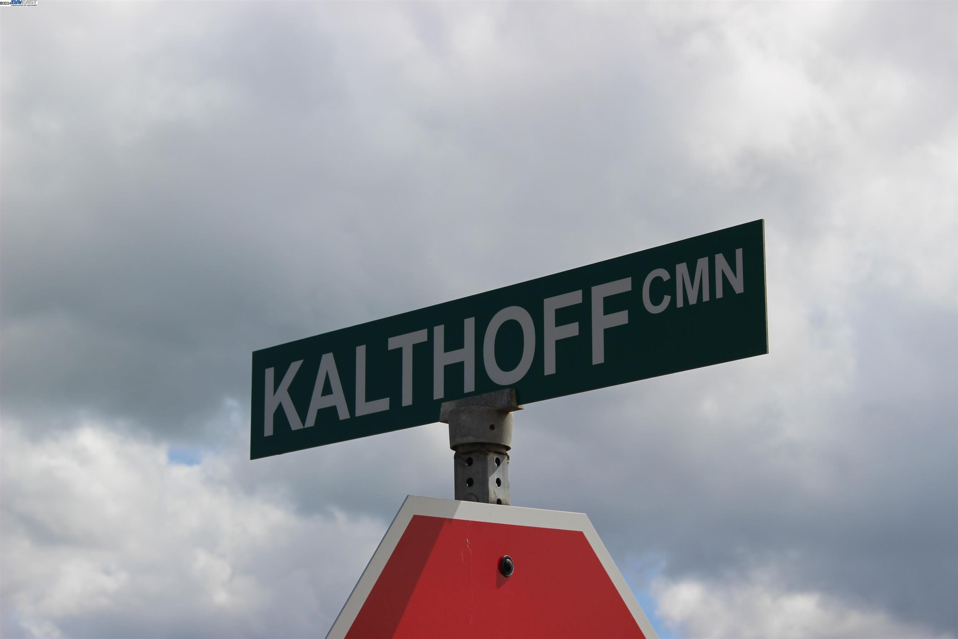 727 Kalthoff Common Livermore, CA 94550 - Photo 1 of 1 a street sign sitting on a wall next to a white wall