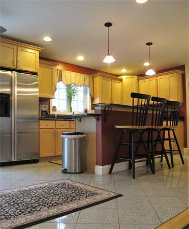 223 Wauwinet Road Barre, MA 01005 - Photo 3 of 24 a kitchen with stainless steel appliances granite countertop a sink a stove a refrigerator a dining table and chairs