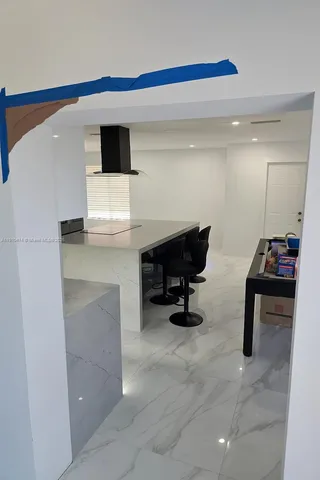 a white toilet sitting next to a bathroom sink