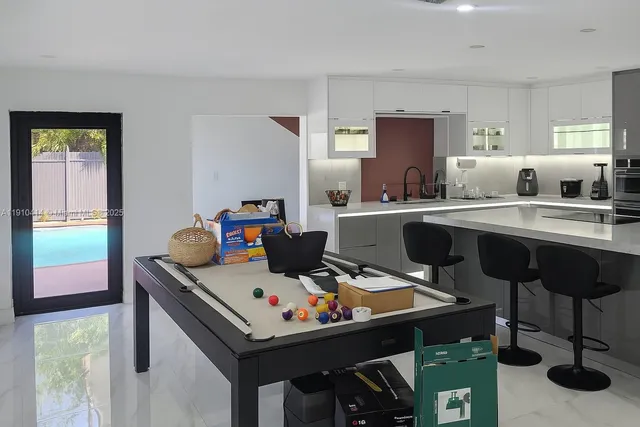 a bathroom with a sink a toilet and window