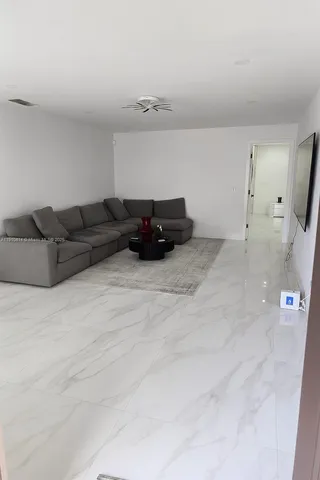 a view of work space with furniture and window