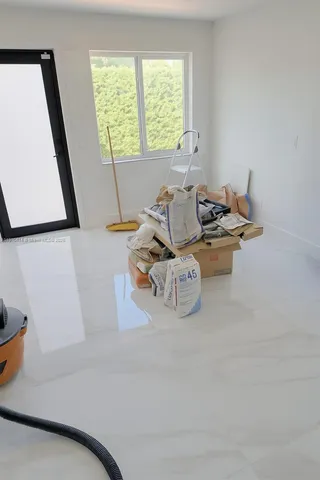 a kitchen with stainless steel appliances a sink a stove top oven a counter space and cabinets