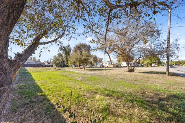 a view of yard with swimming pool