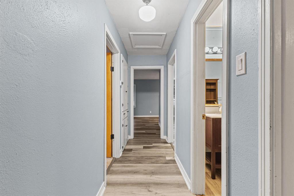 531 West Bullock Street Denison, TX 75020 - Photo 14 of 28 a view of a hallway with wooden floor and entryway