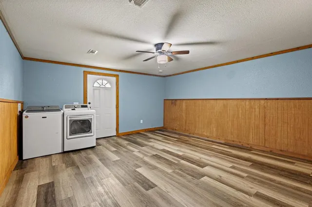 a view of a livingroom with a stove and a microwave