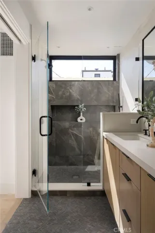 a bathroom with a sink and mirror