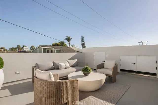a living room with furniture and a wall painting