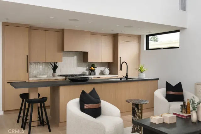 a kitchen with sink and cabinets