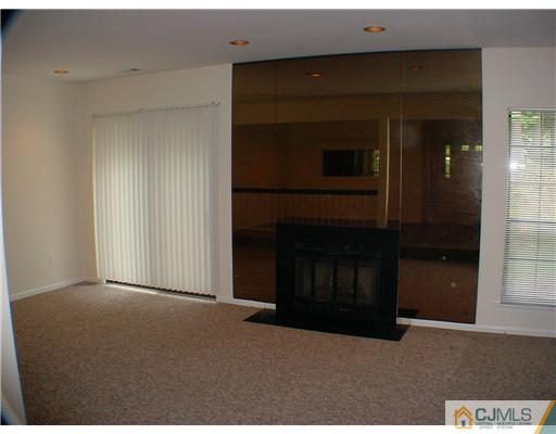 2202 Timber Oaks Road Edison, NJ 08820 - Photo 2 of 10 a living room with a fireplace