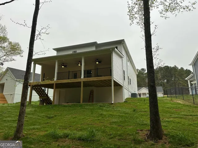 a bathroom with a toilet and a mirror