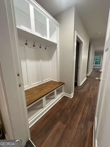 a kitchen with stainless steel appliances granite countertop a refrigerator a sink and a stove