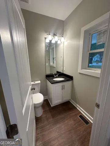 a bathroom with a toilet and a sink
