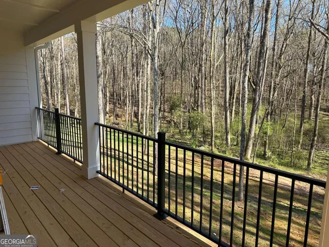 a view of a balcony with wooden floor