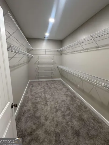 a view of a room with racks on the wall