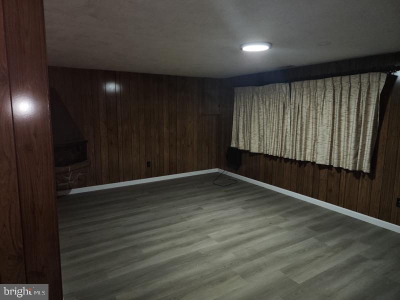 12322 Wyndom Road Philadelphia, PA 19154 - Photo 13 of 13 a view of an empty room with wooden floor and a window