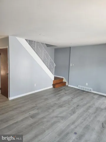 a view of a livingroom with wooden floor