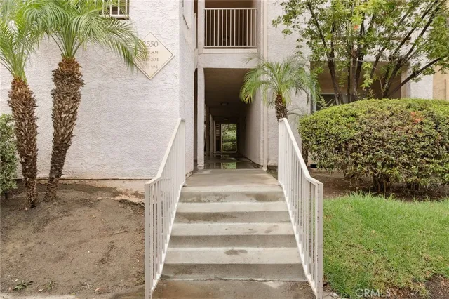 a view of a street with a building in the background