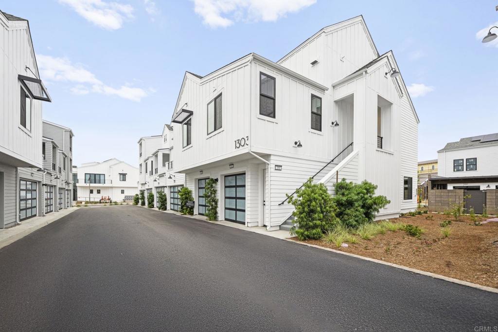 1303 Bergamo Encinitas, CA 92024 - Photo 20 of 21 a large white building with a white roof