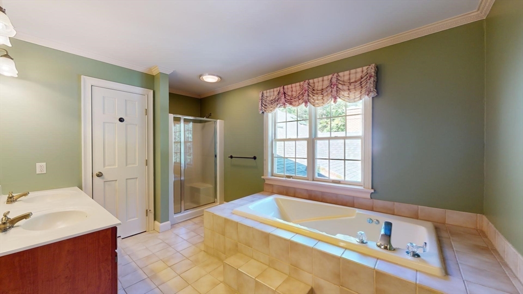 5 Pocumtuck Drive Deerfield, MA 01373 - Photo 33 of 42 a bathroom with a tub a sink and a window