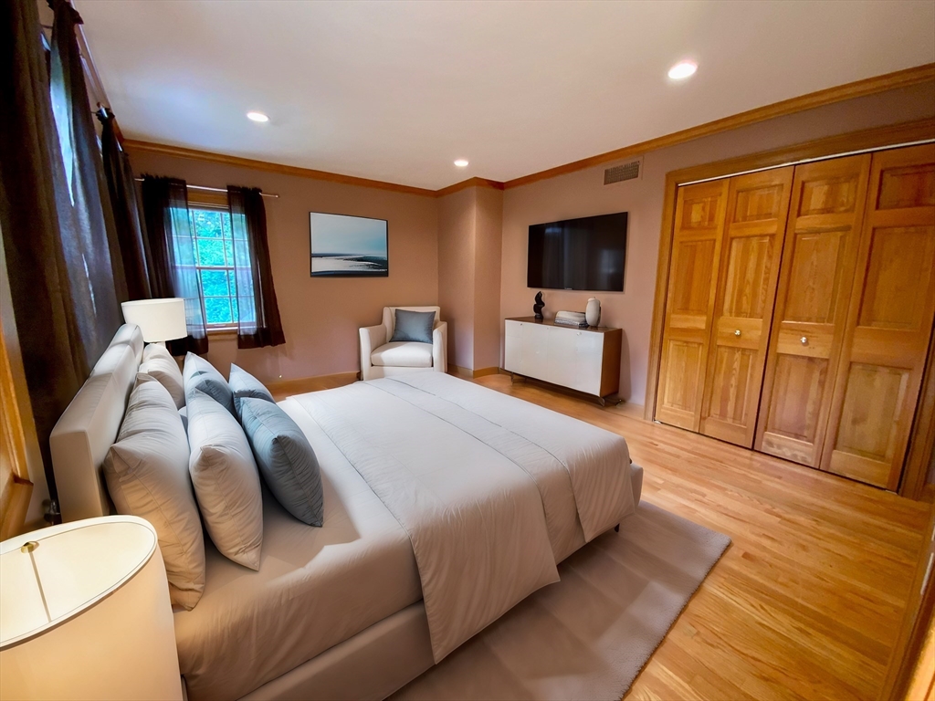 5 Pocumtuck Drive Deerfield, MA 01373 - Photo 34 of 42 a bedroom with a bed and wooden floor