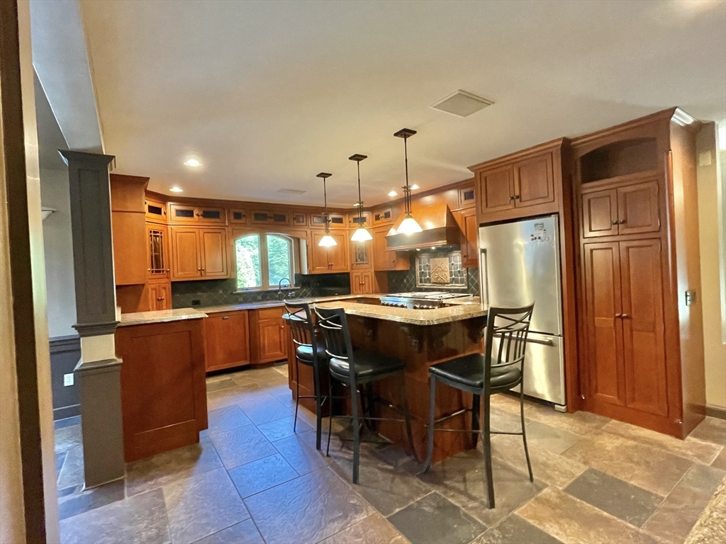 5 Pocumtuck Drive Deerfield, MA 01373 - Photo 4 of 42 a kitchen with a table and chairs in it