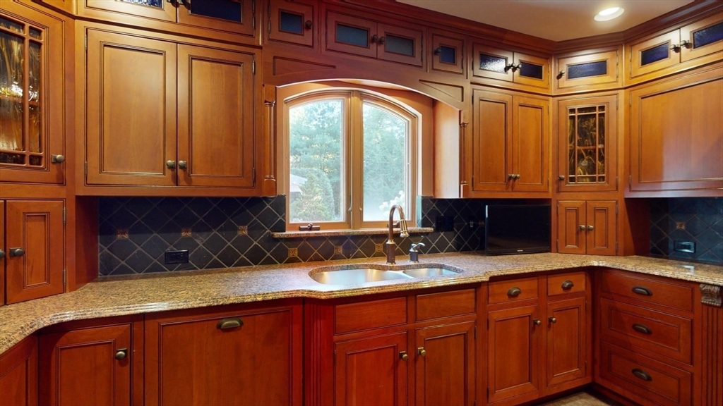 5 Pocumtuck Drive Deerfield, MA 01373 - Photo 7 of 42 a kitchen with stainless steel appliances granite countertop a sink and wooden cabinets