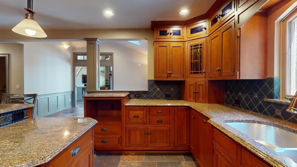 5 Pocumtuck Drive Deerfield, MA 01373 - Photo 8 of 42 a kitchen with stainless steel appliances granite countertop a sink a stove and a wooden cabinets