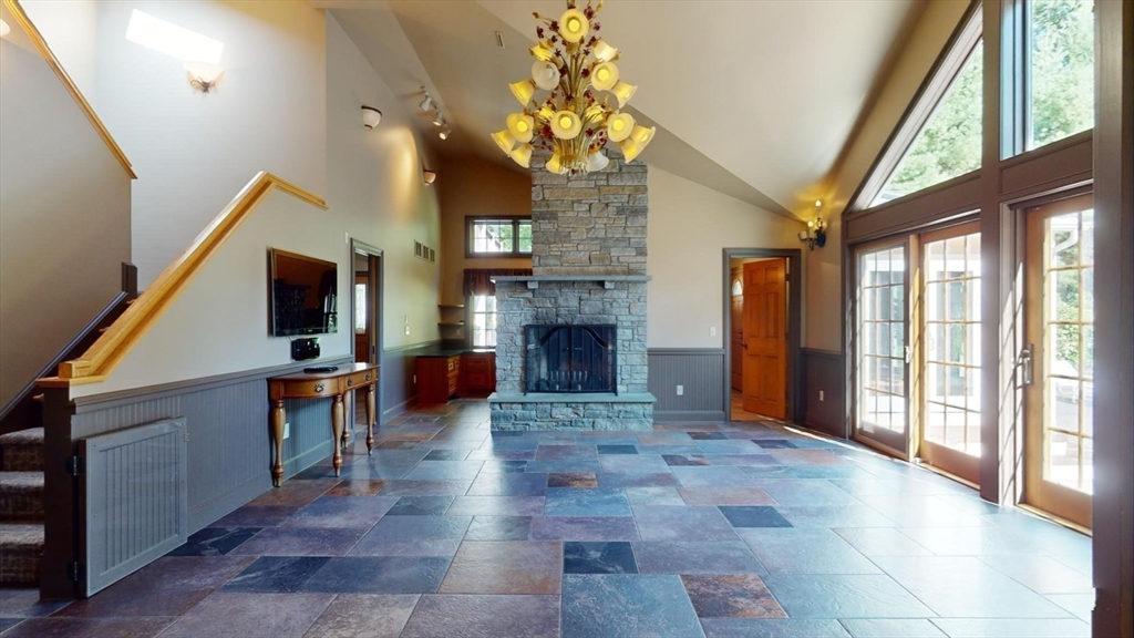 5 Pocumtuck Drive Deerfield, MA 01373 - Photo 10 of 42 a living room with furniture a fireplace and a large window