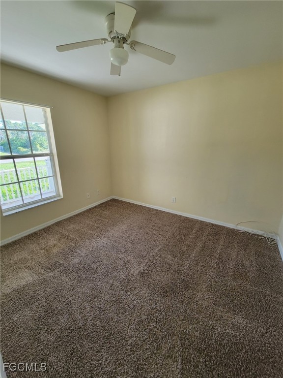 668 Homestead Road South Lehigh Acres, FL 33974 - Photo 11 of 11 an empty room with a window