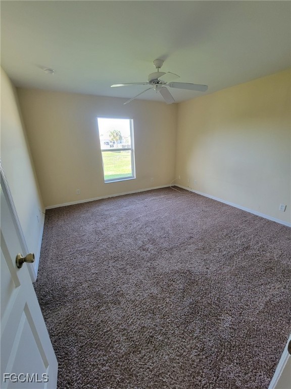668 Homestead Road South Lehigh Acres, FL 33974 - Photo 5 of 11 an empty room with a window