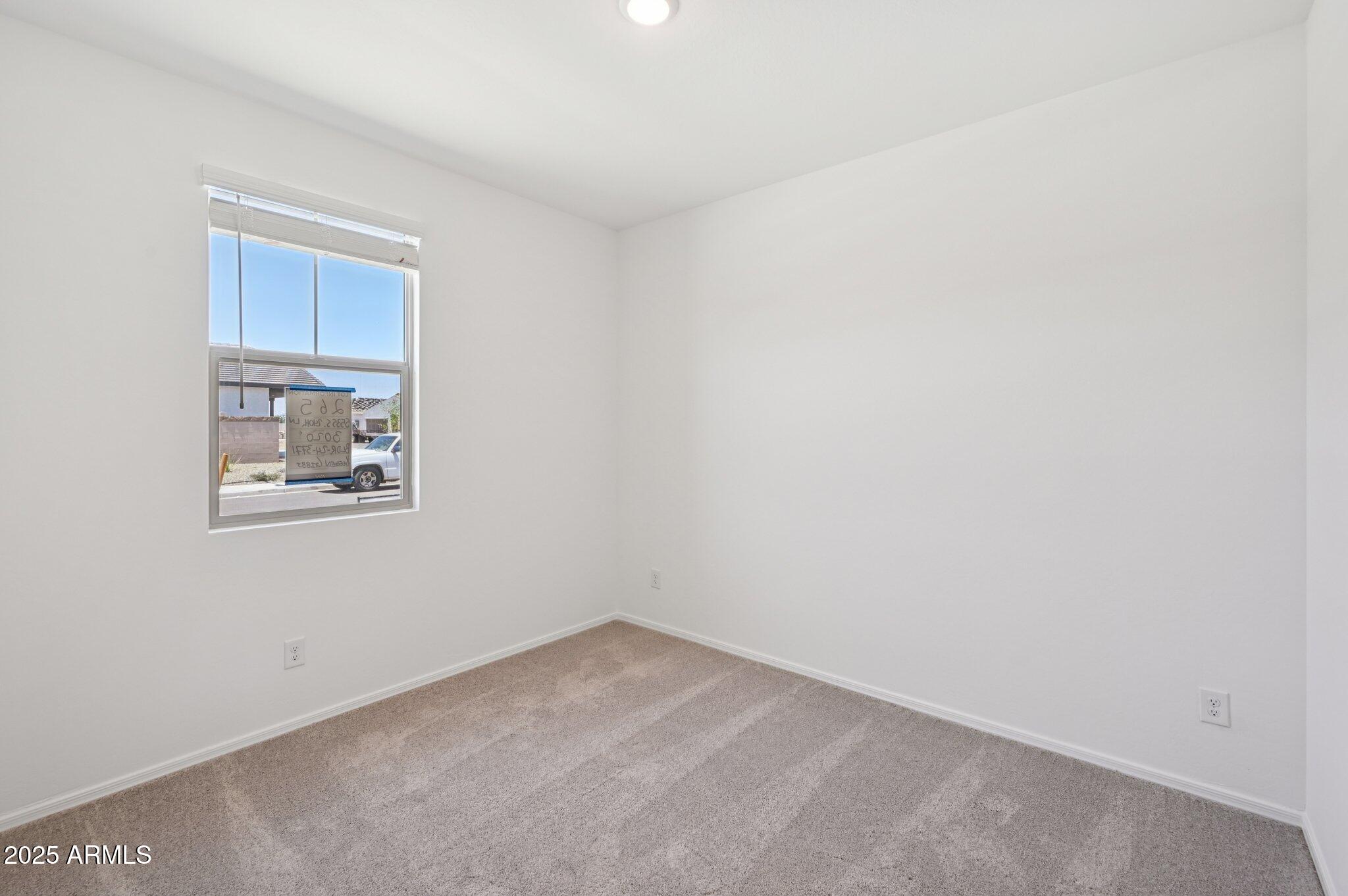 5535 South 240th Lane Buckeye, AZ 85326 - Photo 18 of 57 an empty room with windows