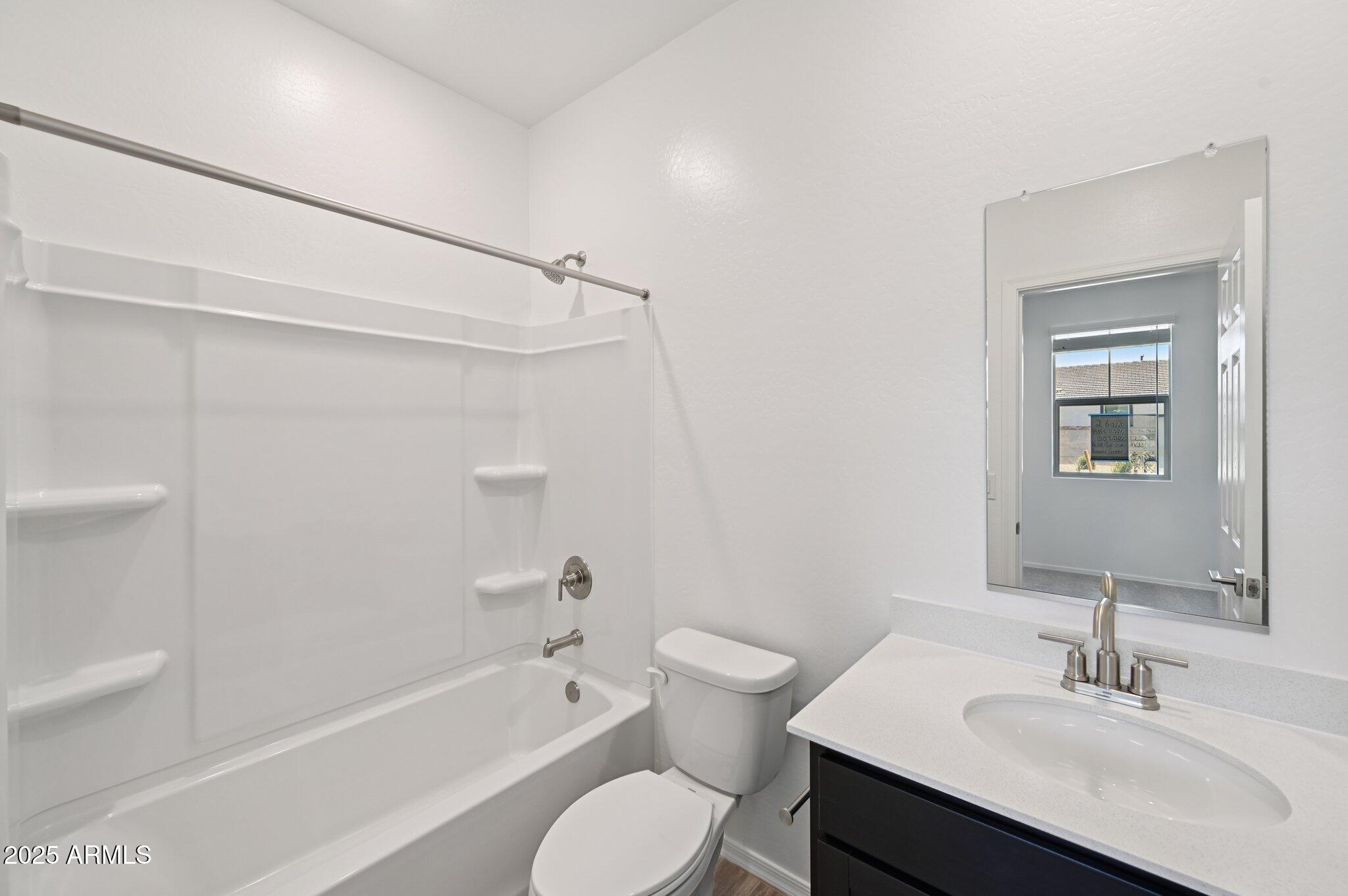 5535 South 240th Lane Buckeye, AZ 85326 - Photo 20 of 57 a bathroom with a sink toilet and shower
