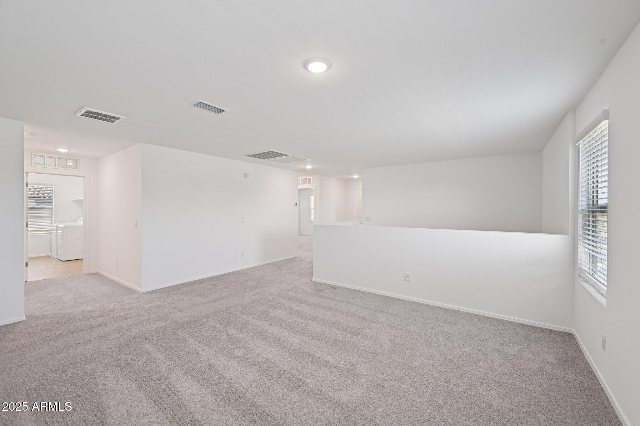 5535 South 240th Lane Buckeye, AZ 85326 - Photo 22 of 57 a view of an empty room with a window
