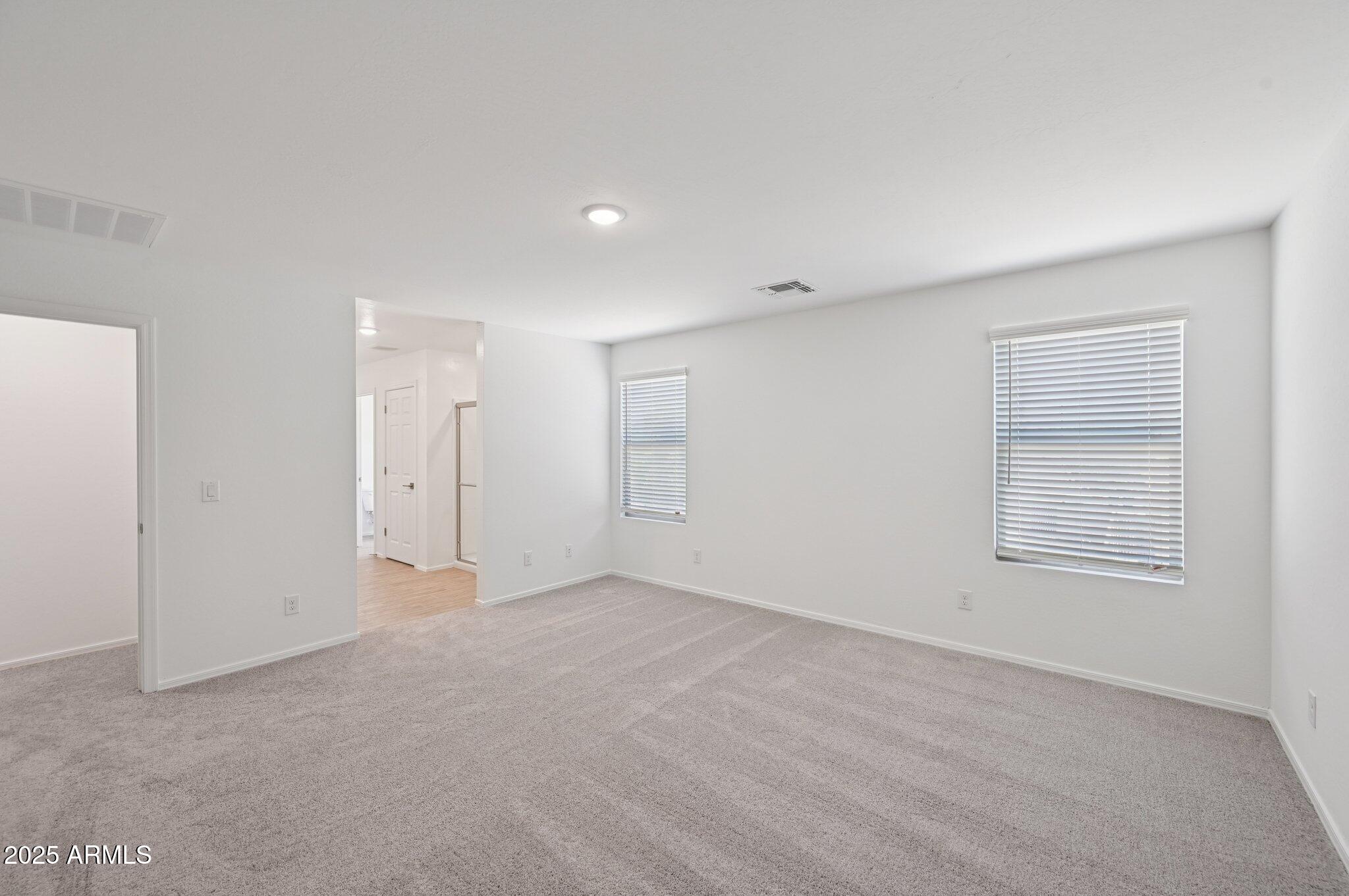 5535 South 240th Lane Buckeye, AZ 85326 - Photo 25 of 57 an empty room with windows