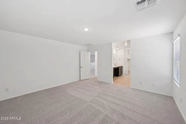 a bathroom with a sink double vanity and a mirror