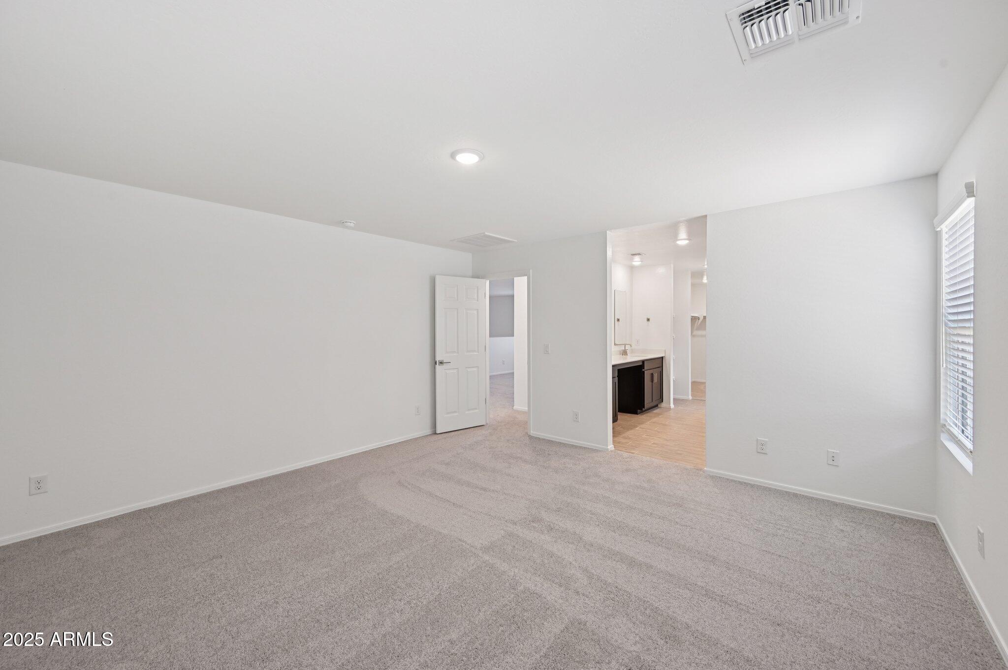 5535 South 240th Lane Buckeye, AZ 85326 - Photo 26 of 57 a view of an empty room with a window