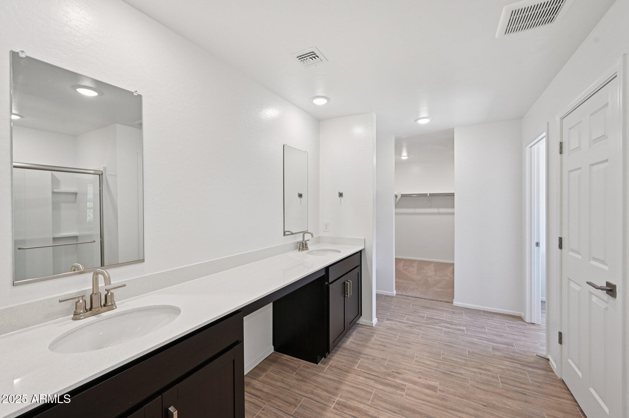 5535 South 240th Lane Buckeye, AZ 85326 - Photo 27 of 57 a bathroom with a sink double vanity and a mirror