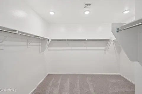 a view of an empty room and a window