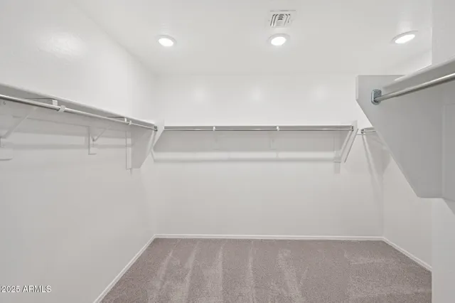 a view of an empty room and a window