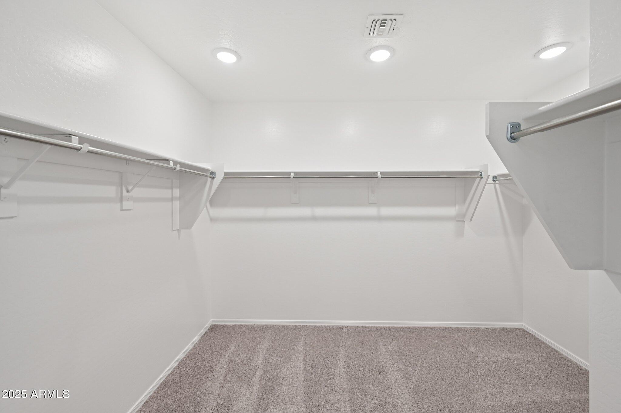 5535 South 240th Lane Buckeye, AZ 85326 - Photo 29 of 57 a view of an empty walk in closet