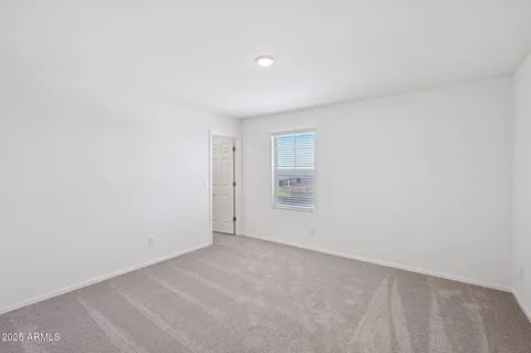 a bathroom with a sink double vanity granite tub shower and a mirror