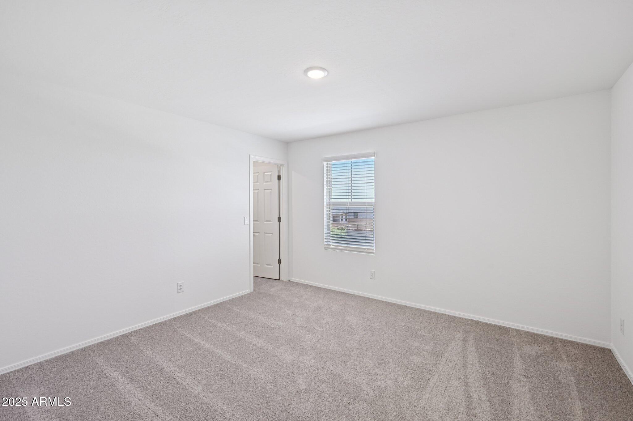 5535 South 240th Lane Buckeye, AZ 85326 - Photo 30 of 57 a view of an empty room and a window