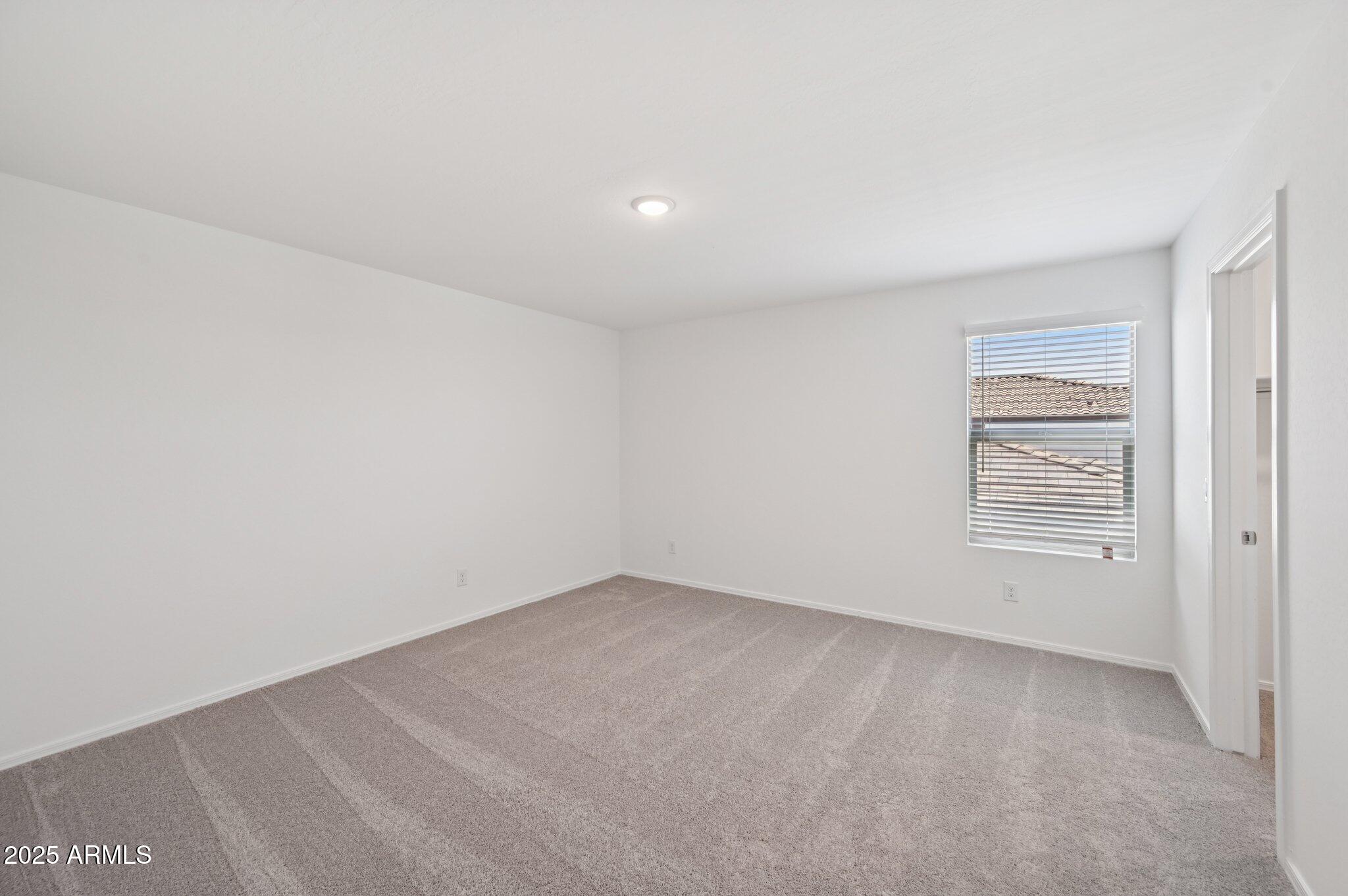 5535 South 240th Lane Buckeye, AZ 85326 - Photo 33 of 57 a view of an empty room and a window