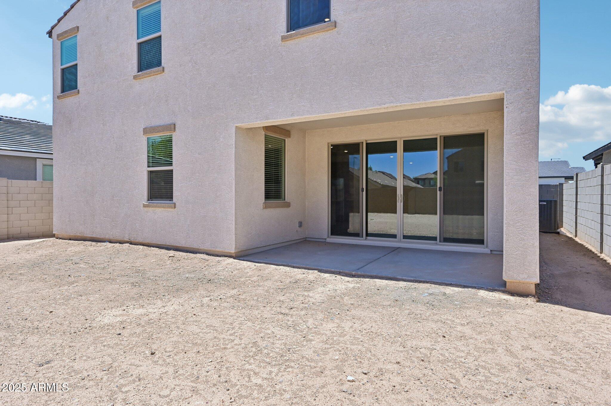5535 South 240th Lane Buckeye, AZ 85326 - Photo 39 of 57 a view of an empty room with wooden floor and a window
