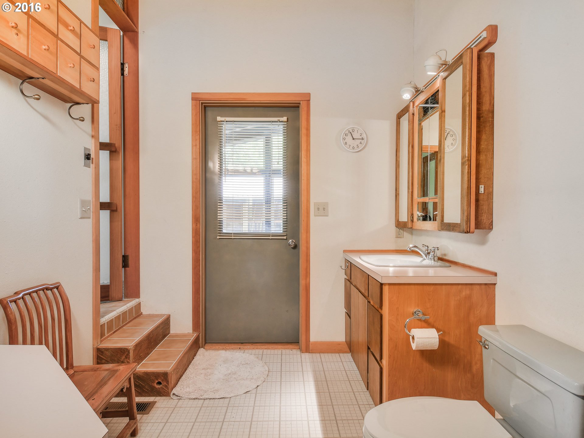 10970 South Mulino Road Canby, OR 97013 - Photo 19 of 32 a bathroom with a toilet sink and mirror