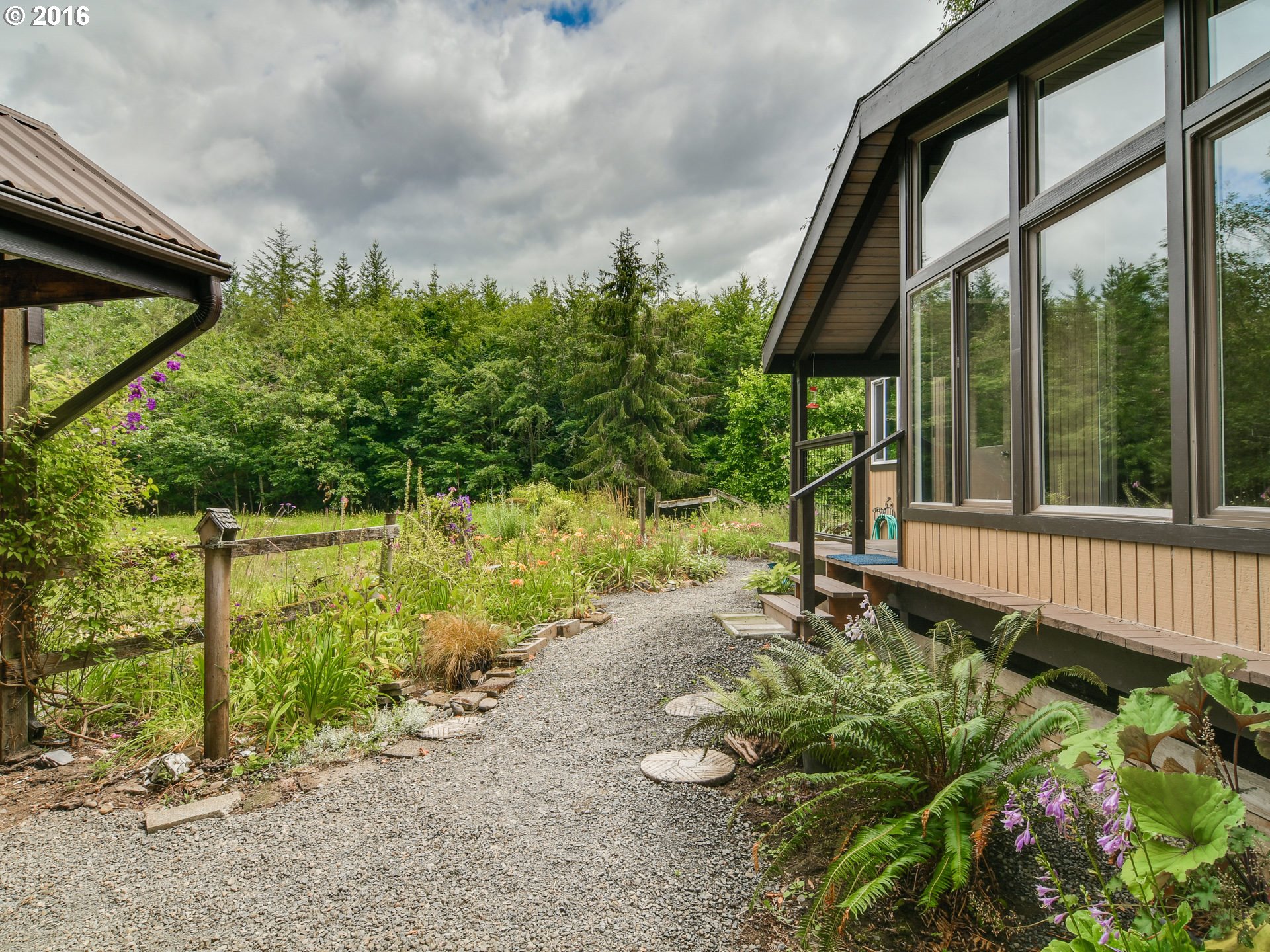 10970 South Mulino Road Canby, OR 97013 - Photo 24 of 32 a garden with trees in the background