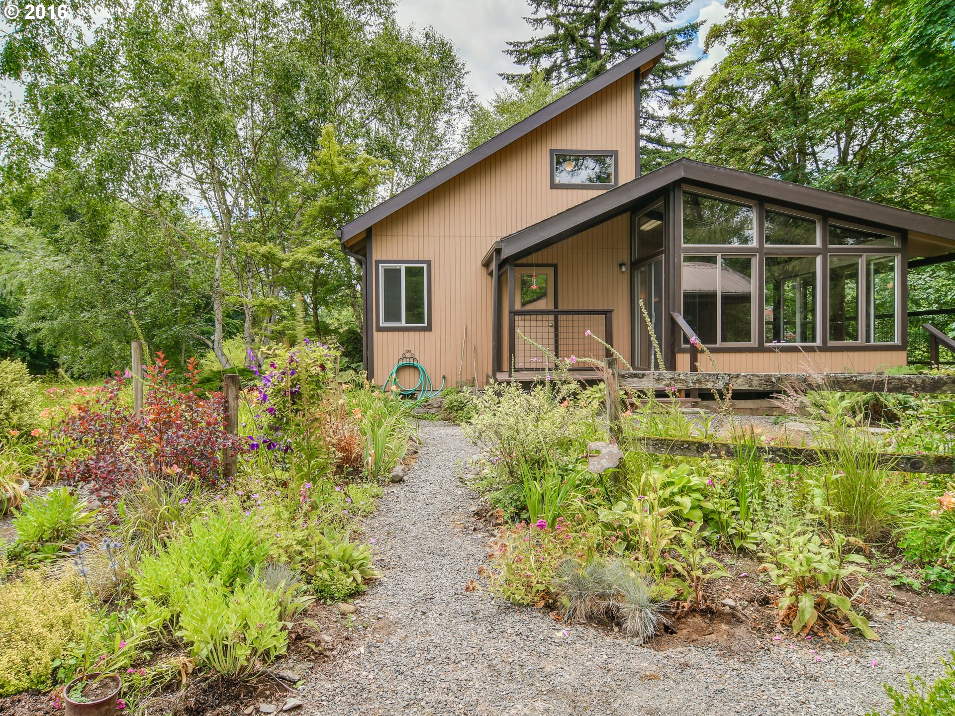 10970 South Mulino Road Canby, OR 97013 - Photo 26 of 32 a front view of a house with a yard