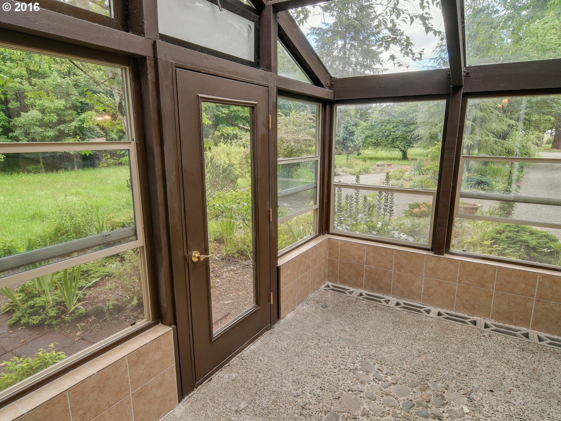10970 South Mulino Road Canby, OR 97013 - Photo 4 of 32 a view of an empty room with wooden floor and a window