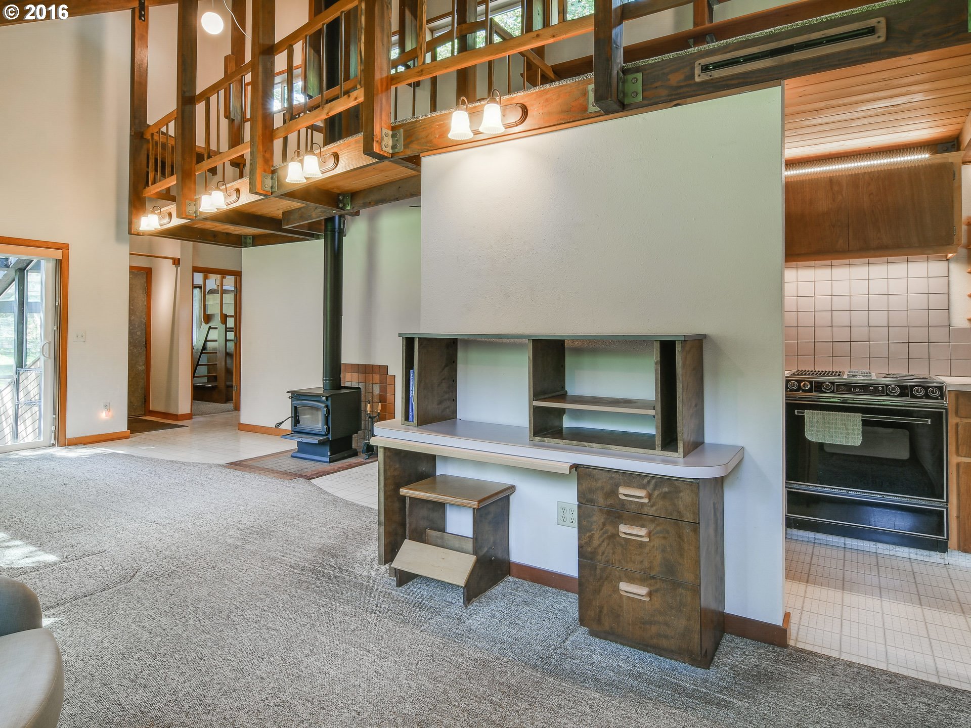 10970 South Mulino Road Canby, OR 97013 - Photo 9 of 32 a view of a kitchen with furniture and a fireplace