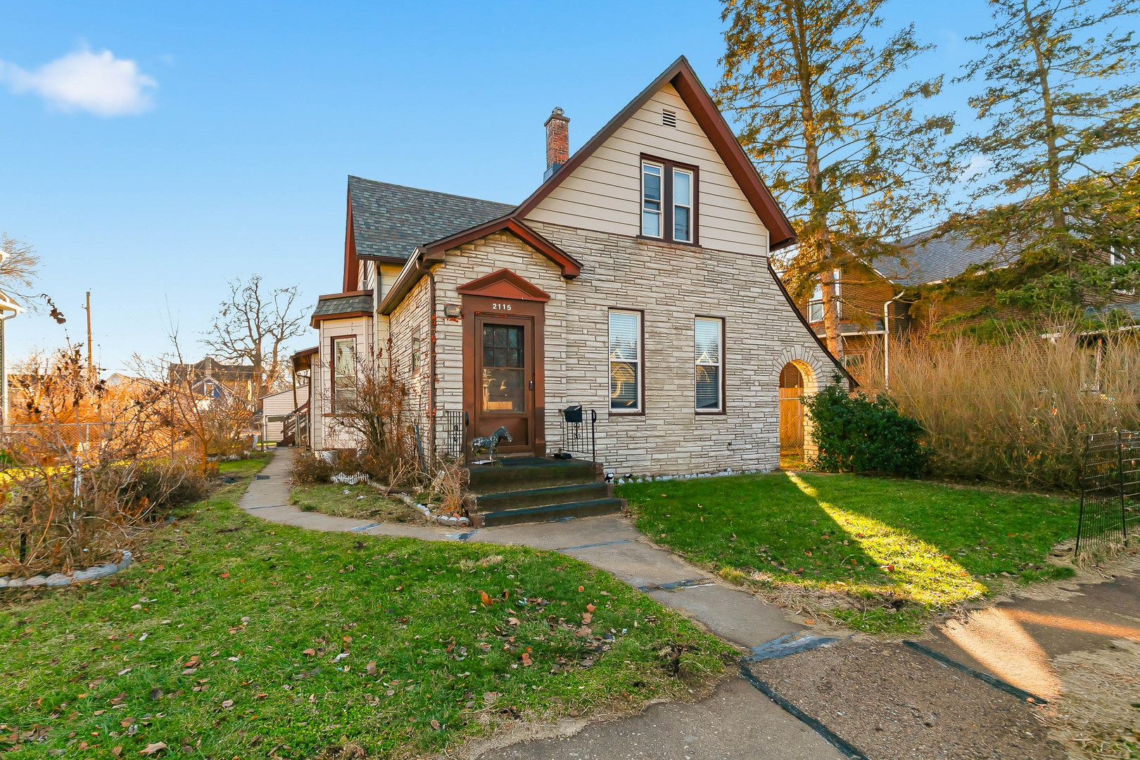 2115 West 4th Street Davenport, IA 52802 - Photo 2 of 24 a front view of a house with garden